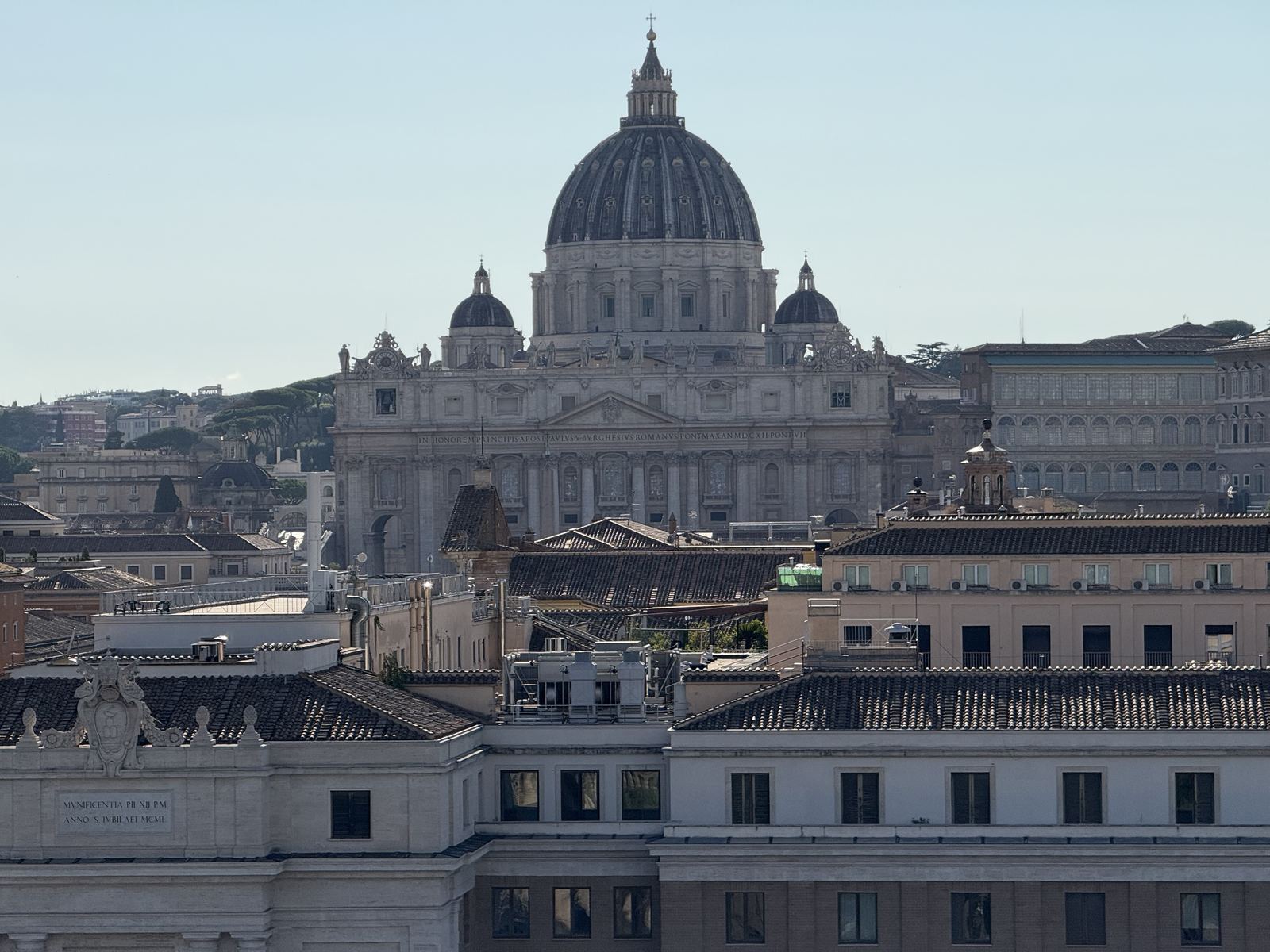 Saint Peter&rsquo;s Basilica rising above Roman rooftops